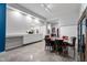 Open-concept dining area with sleek furniture, clean lines, and modern architectural details at 319 Fayetteville St, Raleigh, NC 27601