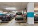 Garage parking space with multiple cars parked in a well-lit indoor parking structure at 319 Fayetteville St, Raleigh, NC 27601