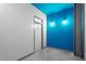Hallway with modern lighting, painted white and blue for an amazing look at 319 Fayetteville St, Raleigh, NC 27601