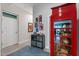 Hallway featuring modern artwork and a red telephone booth leading to other rooms at 319 Fayetteville St, Raleigh, NC 27601