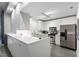 Modern kitchen with sleek white cabinets, stainless steel appliances, and ample counter space at 319 Fayetteville St, Raleigh, NC 27601