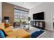 Bright living room features high ceilings, large windows, stylish decor, and a comfortable sectional sofa at 319 Fayetteville St, Raleigh, NC 27601