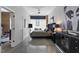 Modern main bedroom with a luxurious bed, stylish decor, and an ensuite bathroom at 319 Fayetteville St, Raleigh, NC 27601