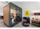 Modern office pod boasts clear walls, minimalist decor, and sleek concrete floors at 319 Fayetteville St, Raleigh, NC 27601