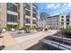 Spacious patio area with seating, tables, and community barbecue grills at 319 Fayetteville St, Raleigh, NC 27601