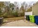 Backyard featuring concrete patio and trash receptacles at 3623 Landshire View Ln, Raleigh, NC 27616