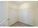 Walk-in closet includes wooden-look floor, wire shelving, and neutral paint throughout at 3623 Landshire View Ln, Raleigh, NC 27616