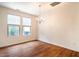 Dining area with great natural light, laminate flooring, and updated light fixture at 3623 Landshire View Ln, Raleigh, NC 27616
