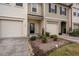 A row of beautifully designed townhomes with individual garages, driveways, and manicured lawns at 3623 Landshire View Ln, Raleigh, NC 27616