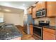 Beautiful kitchen features granite countertops, stainless appliances, and hardwood floors at 3623 Landshire View Ln, Raleigh, NC 27616