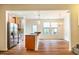 Kitchen view with stainless steel appliances, granite countertop, and open floorplan at 3623 Landshire View Ln, Raleigh, NC 27616