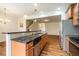 Open-concept kitchen area featuring granite countertops and stainless steel appliances at 3623 Landshire View Ln, Raleigh, NC 27616