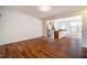An open living area features beautiful flooring and a seamless transition into the kitchen area at 3623 Landshire View Ln, Raleigh, NC 27616