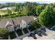 Aerial view showcasing townhome community with modern architecture, landscaping, parking, and convenient access to nearby amenities at 3711 Ramblewood, Durham, NC 27713