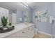 Bathroom featuring a white vanity, neutral tile, and updated fixtures at 3711 Ramblewood, Durham, NC 27713