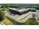 Modern building showcasing sleek architectural design with ample parking and verdant landscaping at 3711 Ramblewood, Durham, NC 27713