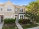 Charming townhome with manicured landscaping, complemented by a welcoming entrance and natural light at 3711 Ramblewood, Durham, NC 27713