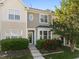 Charming townhouse featuring a well-maintained lawn and mature landscaping around the front at 3711 Ramblewood, Durham, NC 27713