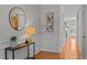 Elegant foyer showcasing classic wainscoting, wood floors, and stylish decor at 3711 Ramblewood, Durham, NC 27713