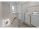 Upstairs laundry room featuring white appliances and storage shelving for added convenience at 3711 Ramblewood, Durham, NC 27713