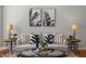 Comfortable living room featuring hardwood floors, modern furnishings, and stylish decor at 3711 Ramblewood, Durham, NC 27713
