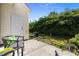 View of the outdoor patio with access to lush green backyard and a glimpse of the surrounding outdoor area at 3711 Ramblewood, Durham, NC 27713