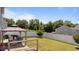 Well-maintained backyard with privacy fence, gazebo, grill, and mature trees at 3936 White Kestreg Dr Dr, Raleigh, NC 27616