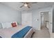 Comfortable bedroom featuring neutral walls, ceiling fan and connecting ensuite at 3936 White Kestreg Dr Dr, Raleigh, NC 27616