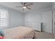 Comfortable bedroom featuring neutral walls, a ceiling fan, and natural light from the window at 3936 White Kestreg Dr Dr, Raleigh, NC 27616