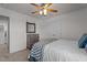 Bright bedroom featuring neutral walls, a ceiling fan, and a dresser next to a closet at 3936 White Kestreg Dr Dr, Raleigh, NC 27616