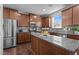 Gourmet kitchen featuring stainless steel appliances, granite countertops, and custom cabinetry at 3936 White Kestreg Dr Dr, Raleigh, NC 27616