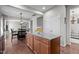 Open concept kitchen with large granite island, stainless appliances, and open view to dining area at 3936 White Kestreg Dr Dr, Raleigh, NC 27616