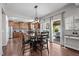 Open kitchen and dining area with wood cabinetry and a sliding glass door to the patio at 3936 White Kestreg Dr Dr, Raleigh, NC 27616