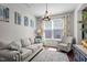 Comfortable living room with neutral tones, patterned accent pillows and chair, and bright natural light at 3936 White Kestreg Dr Dr, Raleigh, NC 27616