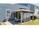Cozy patio featuring a gazebo with comfortable seating and an outdoor grill at 3936 White Kestreg Dr Dr, Raleigh, NC 27616