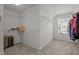 Spacious walk-in closet with carpeted floors, wire shelving, a window, and ample storage space at 3936 White Kestreg Dr Dr, Raleigh, NC 27616