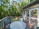 Backyard features a deck with table and chairs, along with a screened-in porch at 404 Woodstar Dr, Cary, NC 27513