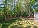 Mature trees surround the backyard, offering plenty of shade and privacy at 404 Woodstar Dr, Cary, NC 27513