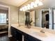 Elegant bathroom boasts double sink vanity, soaking tub, and is well lit with modern fixtures and stylish decor at 404 Woodstar Dr, Cary, NC 27513