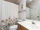 Bathroom includes a vanity, toilet, shower, and floral curtain at 404 Woodstar Dr, Cary, NC 27513
