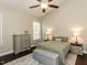 Comfortable bedroom with vaulted ceiling, neutral tones, ceiling fan, and coordinated furnishings creating a relaxing space at 404 Woodstar Dr, Cary, NC 27513