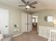 Bright bedroom features ceiling fan, fresh paint, and neutral carpeting at 404 Woodstar Dr, Cary, NC 27513
