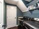 Efficient laundry room with modern washer and dryer, overhead shelving, and ample storage for convenience at 404 Woodstar Dr, Cary, NC 27513
