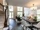 Spacious and inviting living room and dining area with soaring ceilings, dark wood floors, and natural light at 404 Woodstar Dr, Cary, NC 27513