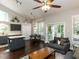 Open-concept living space featuring a kitchen island, dining area, and living room with vaulted ceilings at 404 Woodstar Dr, Cary, NC 27513