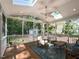Relaxing screened porch with seating, ceiling fan, and natural light at 404 Woodstar Dr, Cary, NC 27513