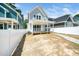View of home's rear exterior featuring backyard, covered porch, and privacy fence at 407 Carolina Ave, Raleigh, NC 27606