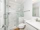 Modern bathroom featuring a glass-enclosed shower with marble tile and a white vanity at 407 Carolina Ave, Raleigh, NC 27606