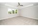 Bedroom with carpet flooring and window views of the surrounding neighborhood at 407 Carolina Ave, Raleigh, NC 27606
