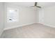 Bedroom with carpet flooring, ceiling fan, and large window at 407 Carolina Ave, Raleigh, NC 27606